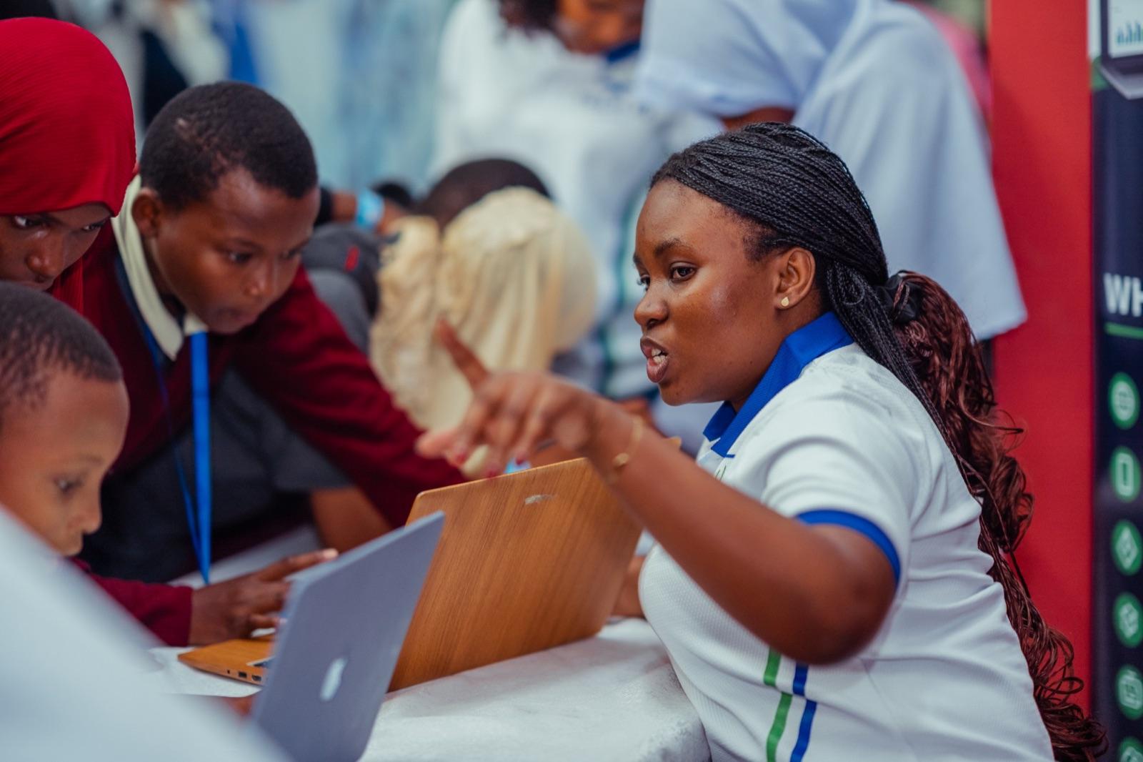 A TECH IQ instructor guiding students through a lesson