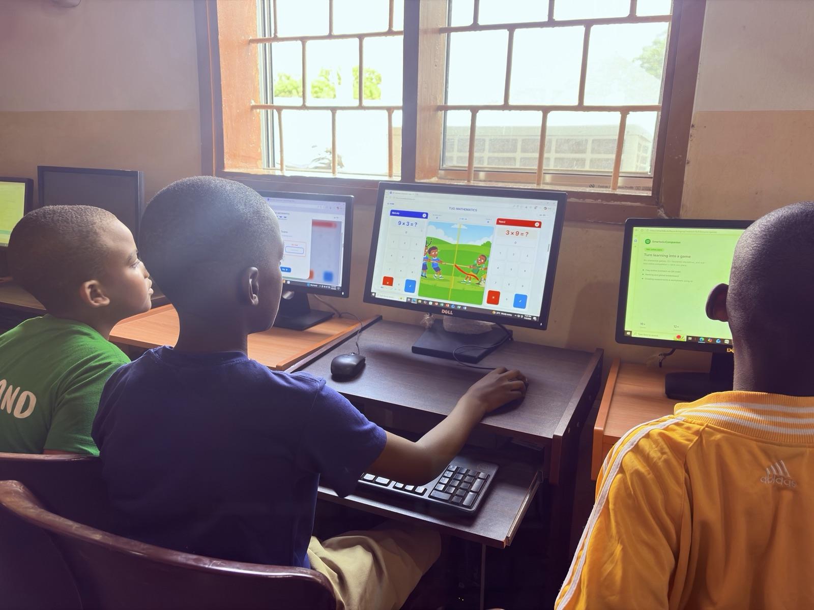Pupils playing SmartEdu learning games in the school computer lab