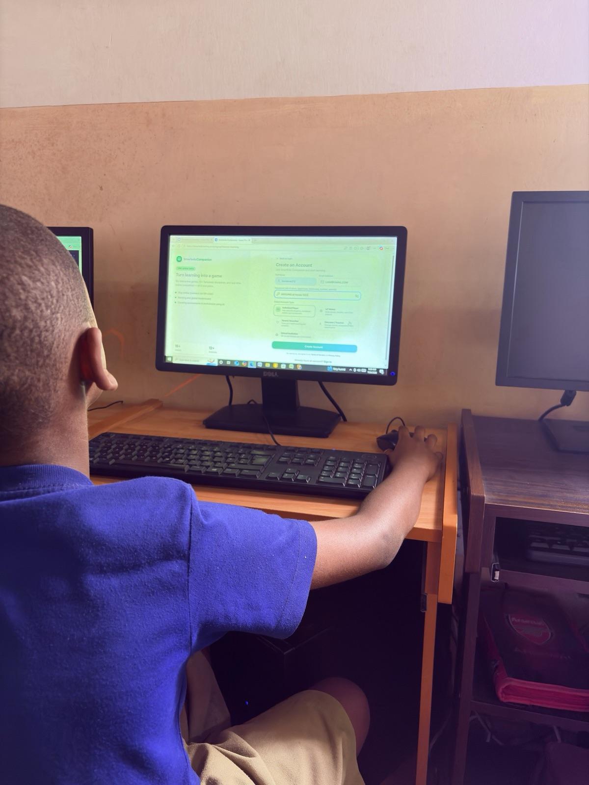 A pupil answering SmartEdu questions on a lab computer